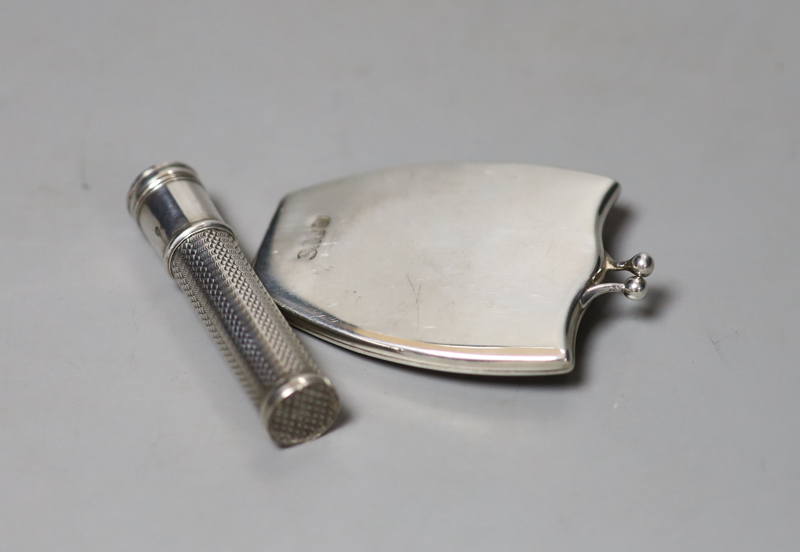 An Edwardian silver box modelled as a miniature table, Birmingham, A & J Zimmerman, Birmingham, 1909, height 35mm, a silver shield shaped locket, modelled as a purse and a white metal seal holder containing three seals.